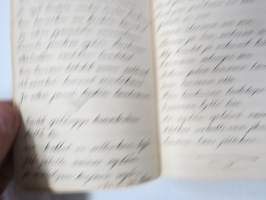 Lauluja - 1928, perinteinen musta vahakantinen vihko, johon kirjoitettu laulujen sanoja