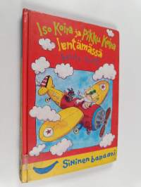 Iso Koira ja Pikku Koira lentämässä