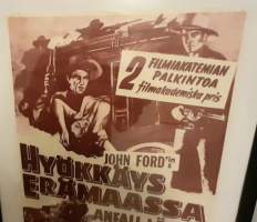 Elokuvajuliste; Hyökkäys erämaassa.KEHYSTETTY