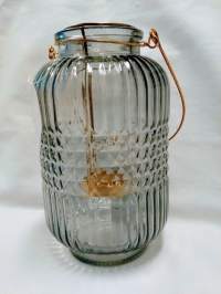 Harmaa lasinen tuikkulyhty käyttämätön