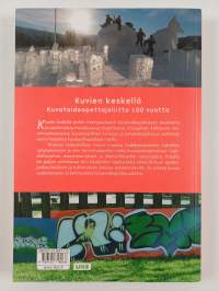 Kuvien keskellä : Kuvataideopettajaliitto 100 vuotta