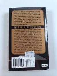 The man in the brown suit