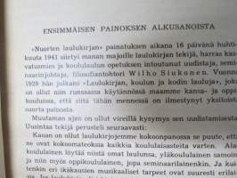 Nuorten laulukirja ja koululaisen musiikkitieto, kansikuvitus Martta Wendelin
