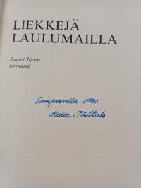 Liekkejä laulumailla (signeerattu)