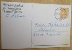 Postikortti - Joulukortti : Marjaliisa Pitkäranta - Joulupukki jakamassa lahjoja, Kulkenut, postilema ja Postimerkki 1974