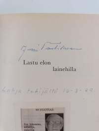Lastu elon lainehilla (signeerattu)