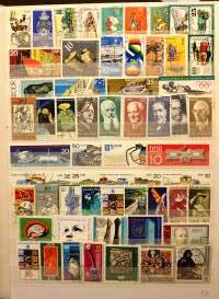Filatelia - Postimerkkikokoelma 2 säilökirjassa: DDR n. 750 erilaista; Puola, Ranska, Ruotsi, Brasilia, Italia, Belgia, Jugoslavia, Romania ja Espanja (265 eril)