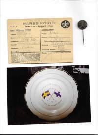 Me marssimme – Kuvateos Suomen ja Ruotsin välisestä marssimaaottelusta v. 1941 sekä marssikortti, marssimerkki sekä valokuva marssilautasesta