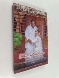 Hänen sylinsä suojassa : Matkani pimeydestä valoon Sri Mata Amritanandamayi Devin kanssa