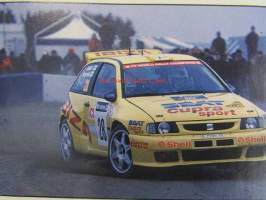 Vauhdin Maailma 1998 nr 12 -mm. Max Mosley Esa iloinen haastatteli FIA:N ykkösmiestä, Mika Häkkinen Kerkkitoute vai jäyhä suomalainen, MM-ralli Australia ja